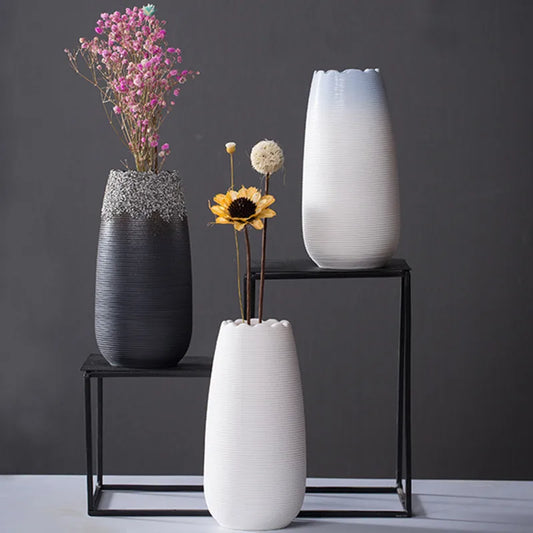 Handcrafted modern ceramic vase with a unique artisan design, featuring smooth curves and a minimalist aesthetic