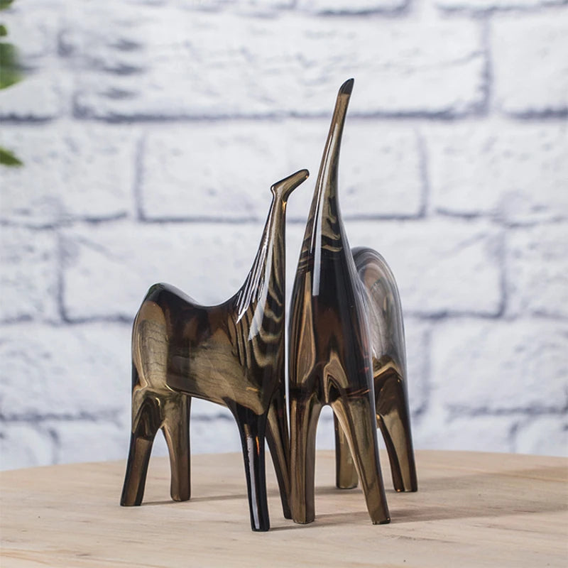 Abstract resin sculpture of horse couple and foal, minimalist geometric design perfect for adding a modern touch to contemporary home decor.