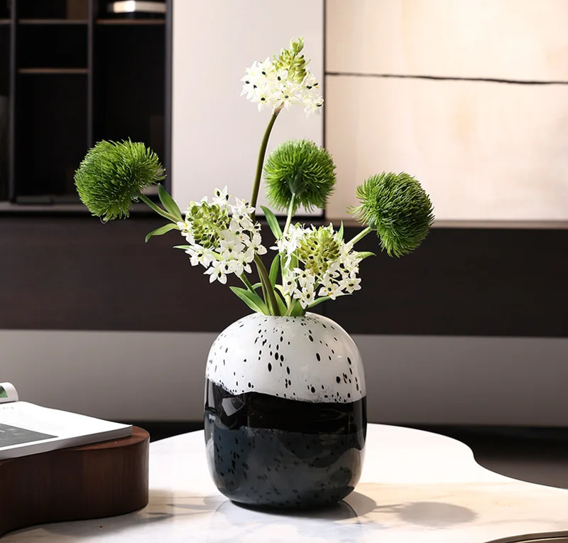 Elegant Art Deco black and white vase featuring geometric patterns and sleek lines.