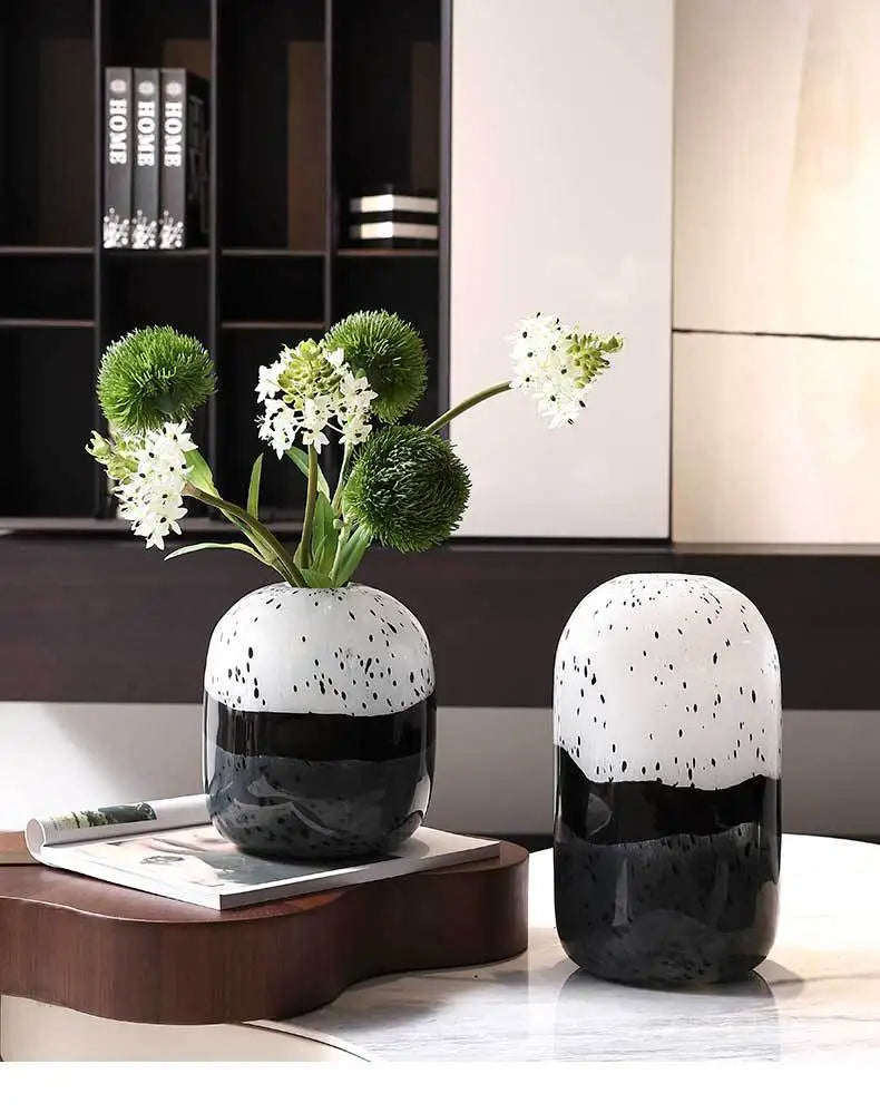 Elegant Art Deco black and white vase featuring geometric patterns and sleek lines.