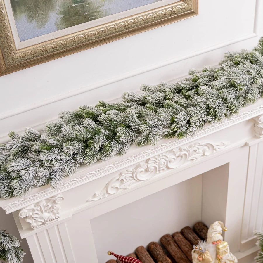 Artificial Christmas tree branch in green and white, ideal for festive table or fireplace decor.