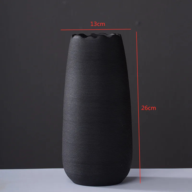 Handcrafted modern ceramic vase with a unique artisan design, featuring smooth curves and a minimalist aesthetic