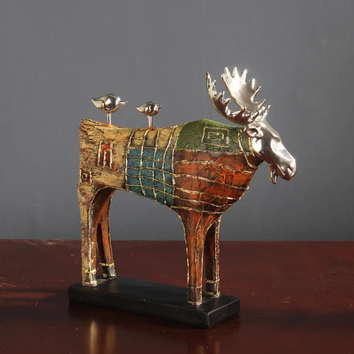 Sophisticated Painted Deer Sculpture with gold details, in green, red, and brown, perfect for adding vintage charm to any room.