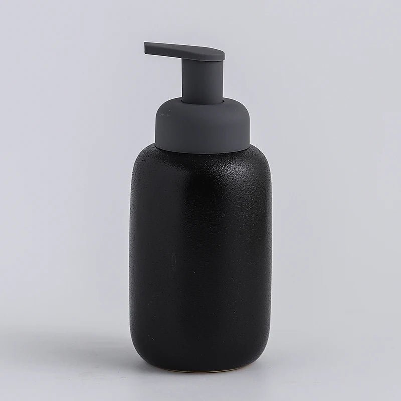 A black ceramic soap dispenser with a sleek design, ideal for modern bathroom decor.