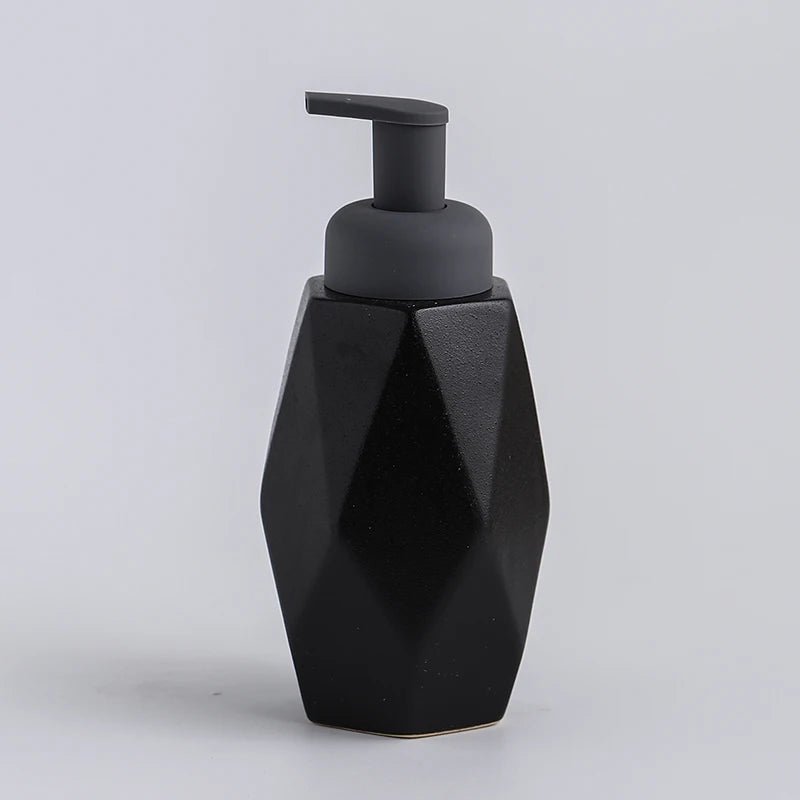 A black ceramic soap dispenser with a sleek design, ideal for modern bathroom decor.