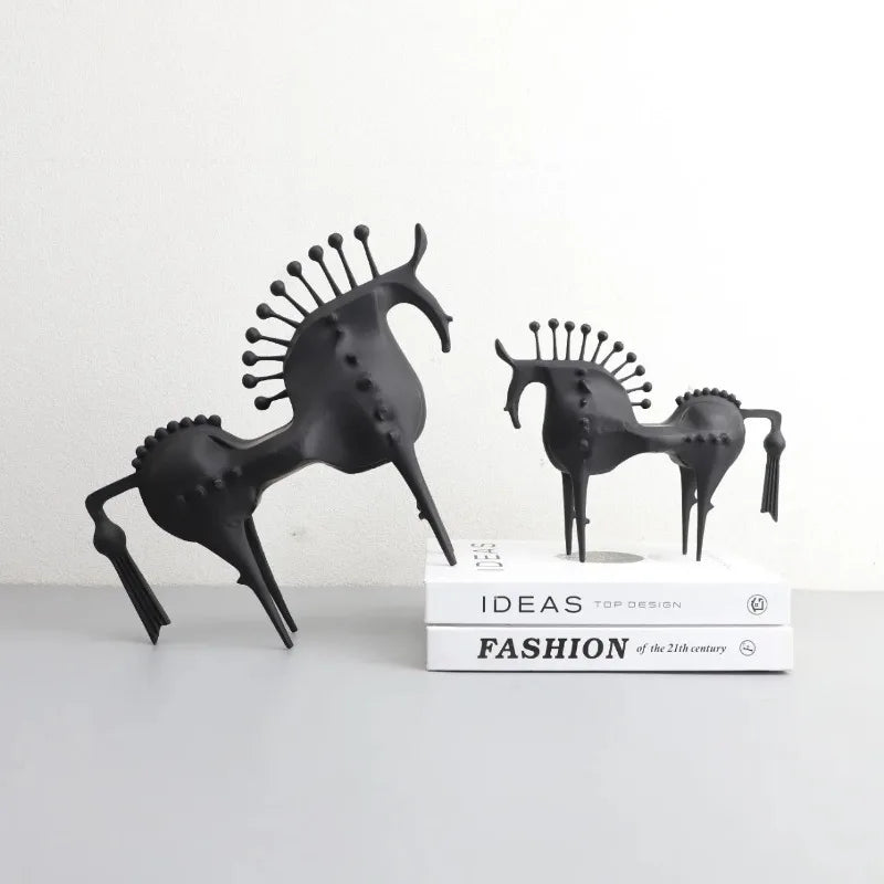 A black horse sculpture with a sleek design, made for home or office decoration.