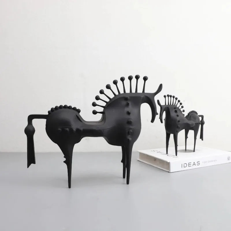 A black horse sculpture with a sleek design, made for home or office decoration.