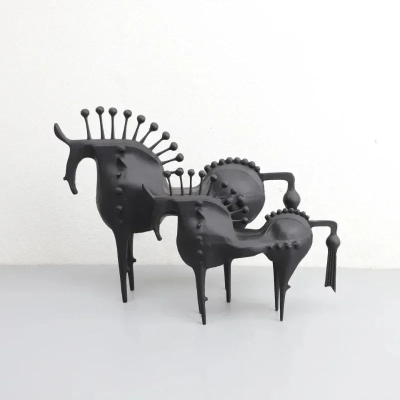 A black horse sculpture with a sleek design, made for home or office decoration.