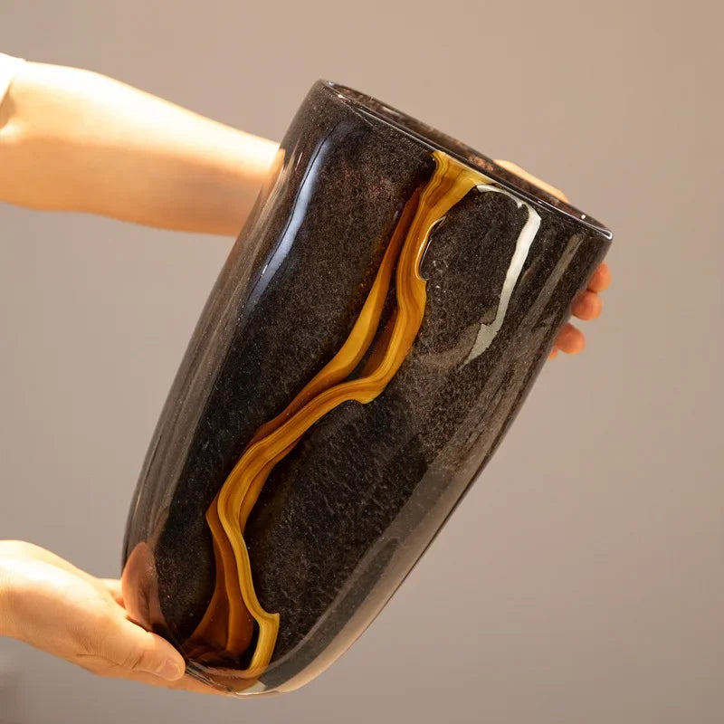 Black ripple glass vase with mustard-yellow wave detailing