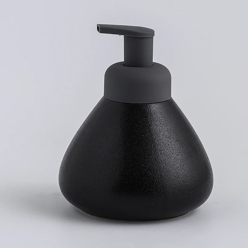 A black ceramic soap dispenser with a sleek design, ideal for modern bathroom decor.