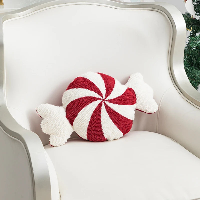 soft candy cane-shaped pillows with red and white stripes.