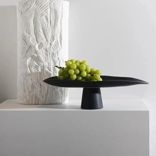 Modern ceramic high centerpiece tray in black or white with curvy, irregular lines, perfect as decor or fruit holder.