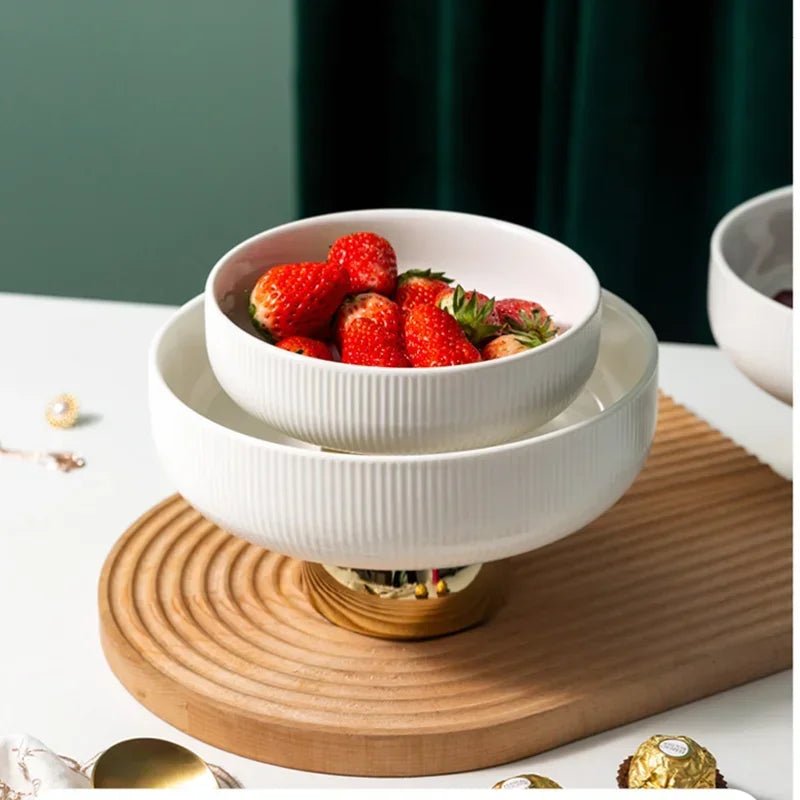 Two ceramic fruit bowls filled with strawberries