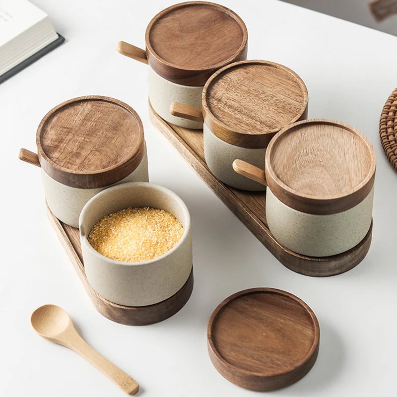 Five sets of ceramic seasoning jars with wooden lids, neatly arranged