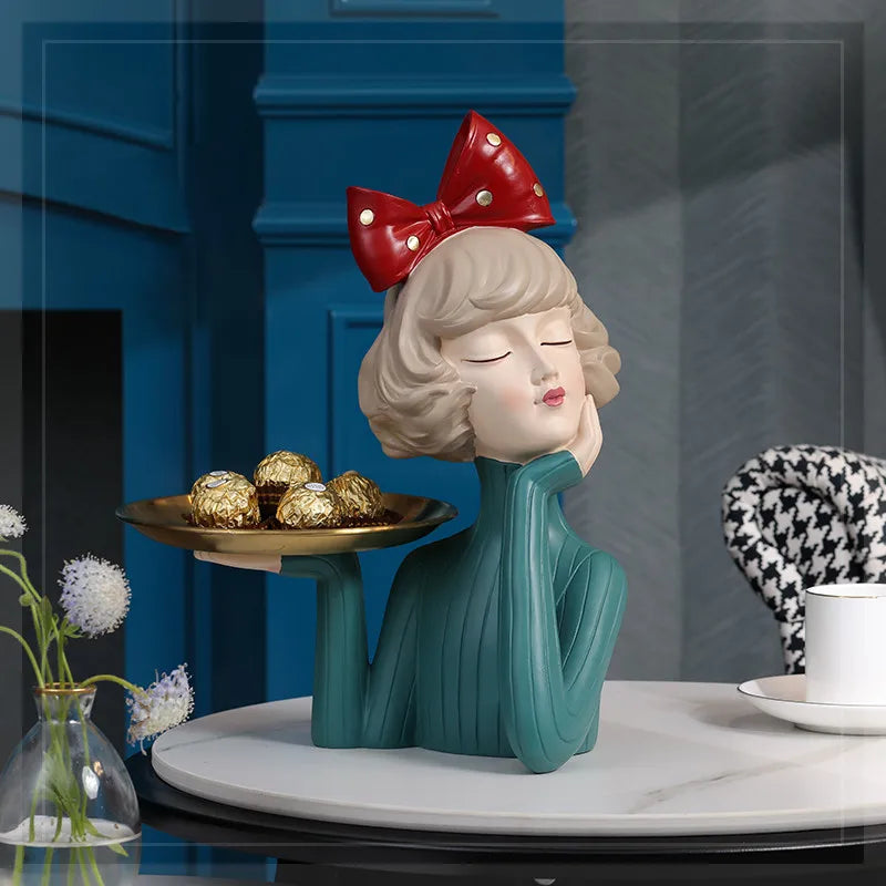 A charming girl statue holding a tray, perfect as a decorative piece.