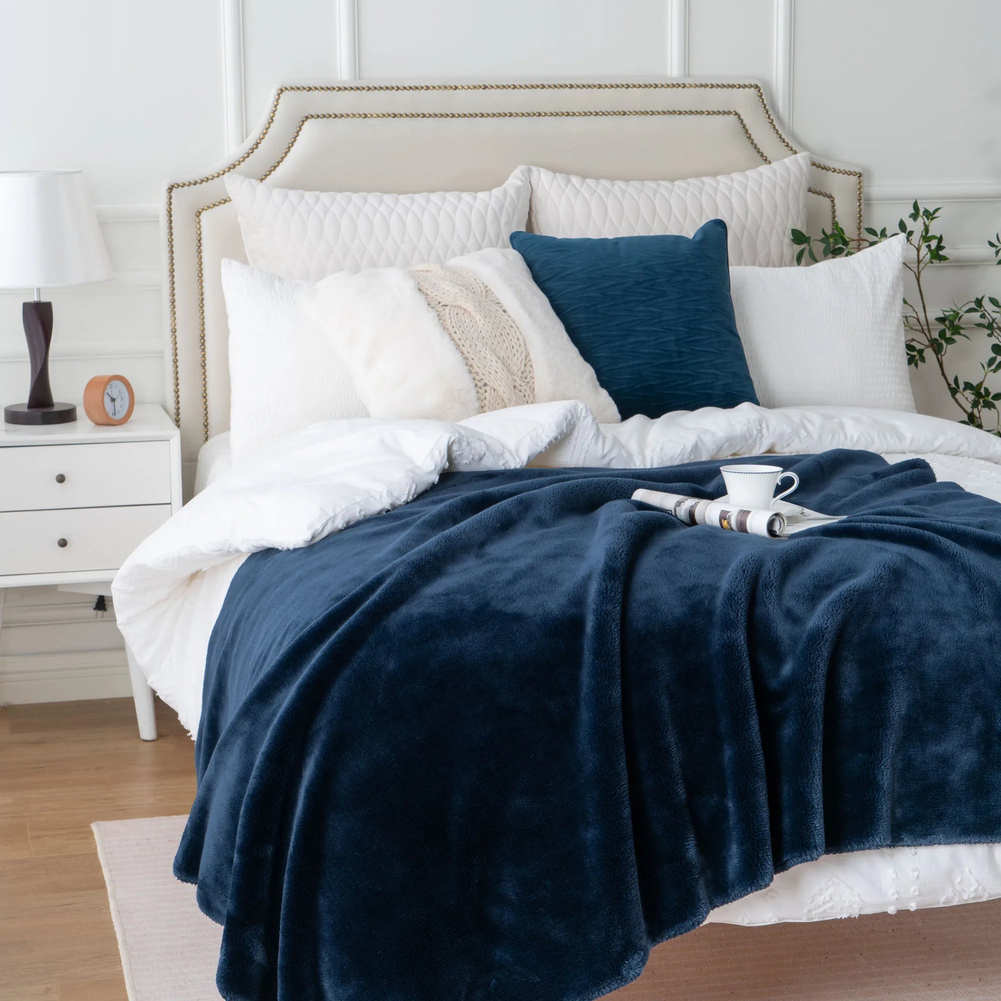 Cozy heavyweight plush flannel blanket draped over a couch, showcasing its thick and fuzzy texture.