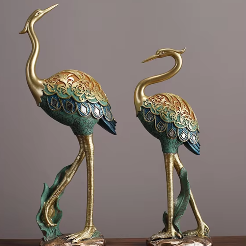 An elegant crane bird statue made of resin. Perfect for home decor or garden decoration.