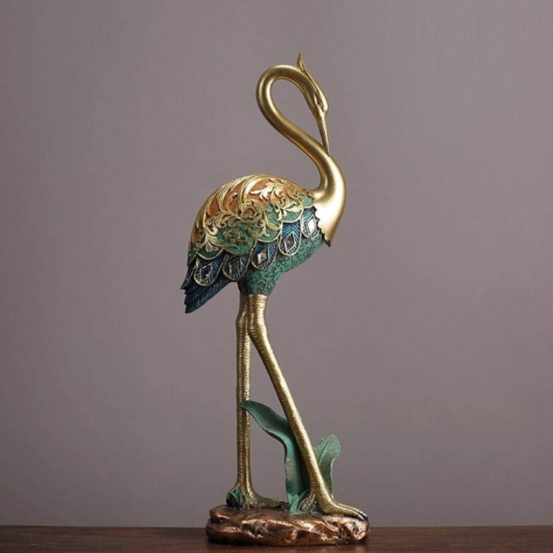 An elegant crane bird statue made of resin. Perfect for home decor or garden decoration.