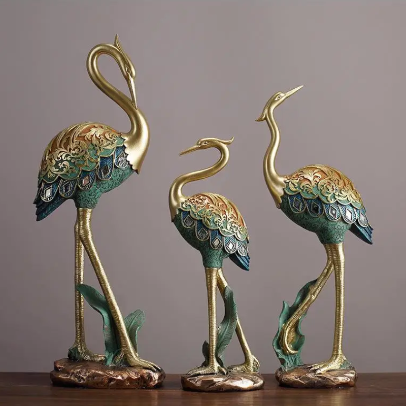 An elegant crane bird statue made of resin. Perfect for home decor or garden decoration.