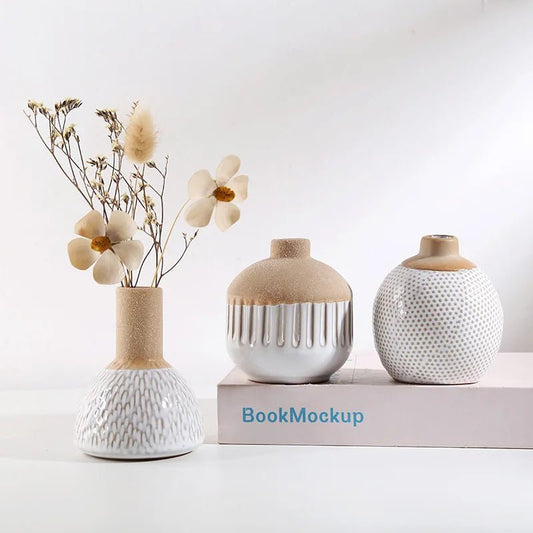 Three creative ceramic vases with different shapes placed on a table