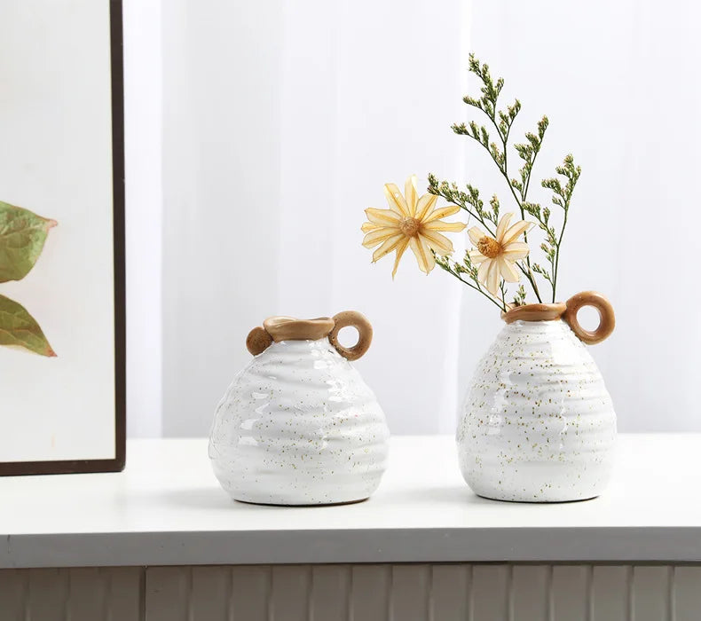 A set of two Vintage Charm Ceramic Vases with handles, displaying intricate vintage designs perfect for adding an elegant touch to home decor.