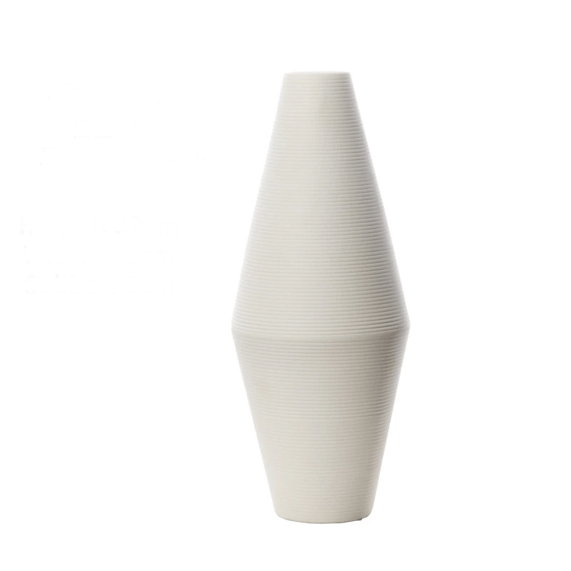 Elegant white brushed ceramic vase iin a white background.