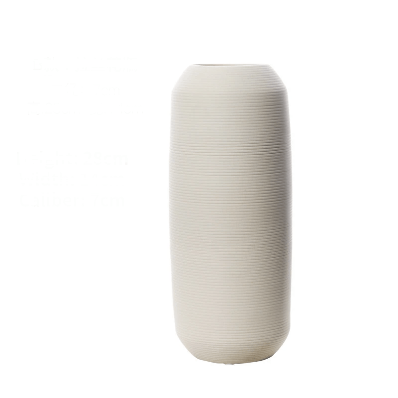 Elegant white brushed ceramic vase iin a white background.