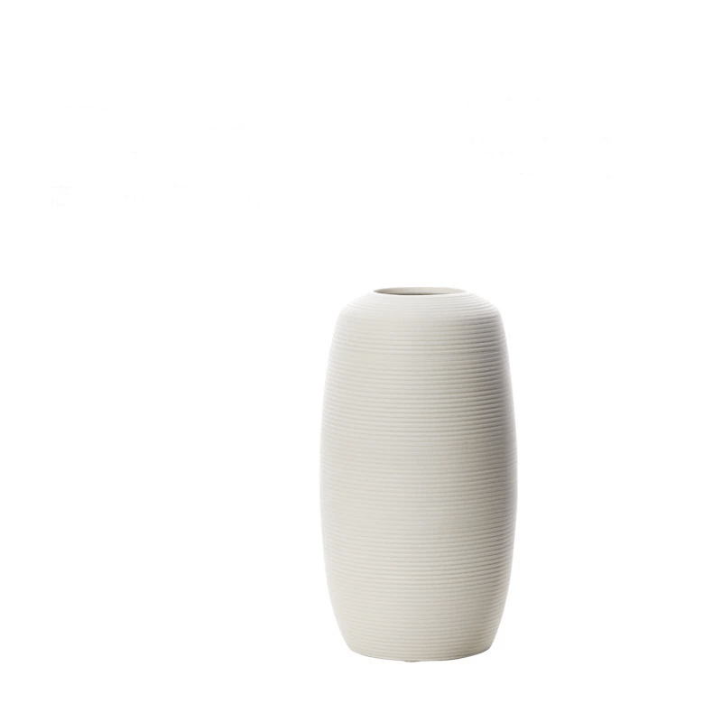 Elegant white brushed ceramic vase iin a white background.