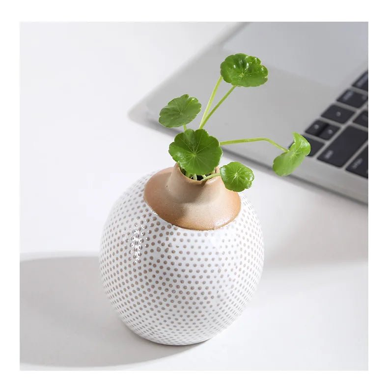 A creative ceramic vase showcasing an elegant and artistic arrangement perfect for home decor.