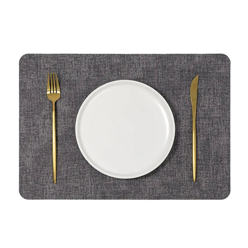 A faux letaher texture placemat on a dining table, perfect for protecting surfaces and adding a natural touch to your decor.