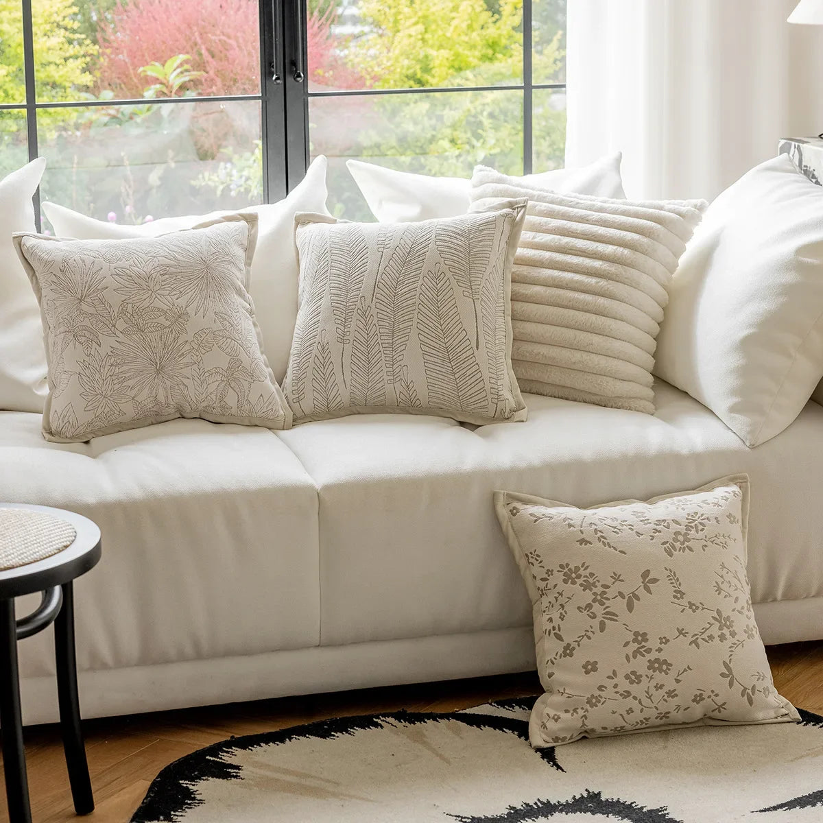 French cream-style jacquard pillow cover with beige tones and delicate floral and leaf patterns, perfect for adding a touch of charm and sophistication to sofas or living rooms.