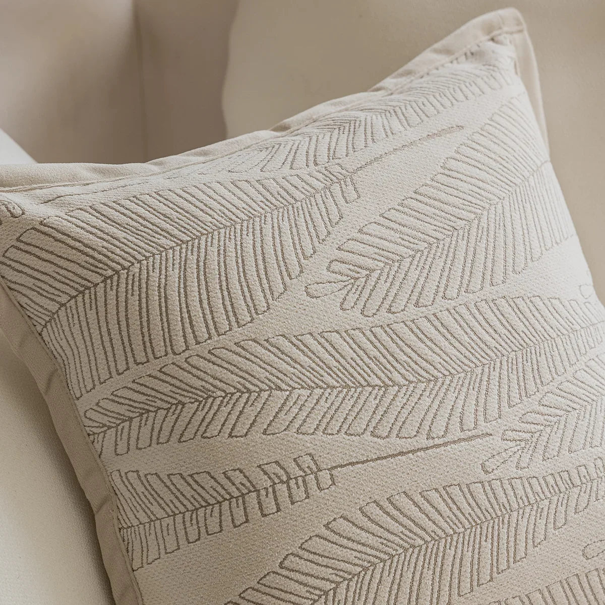 French cream-style jacquard pillow cover with beige tones and delicate floral and leaf patterns, perfect for adding a touch of charm and sophistication to sofas or living rooms.