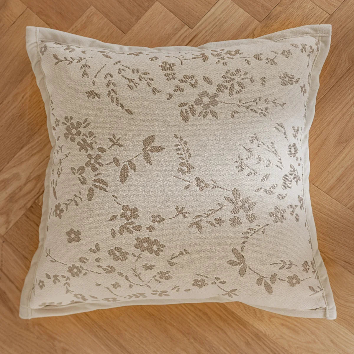 French cream-style jacquard pillow cover with beige tones and delicate floral and leaf patterns, perfect for adding a touch of charm and sophistication to sofas or living rooms.