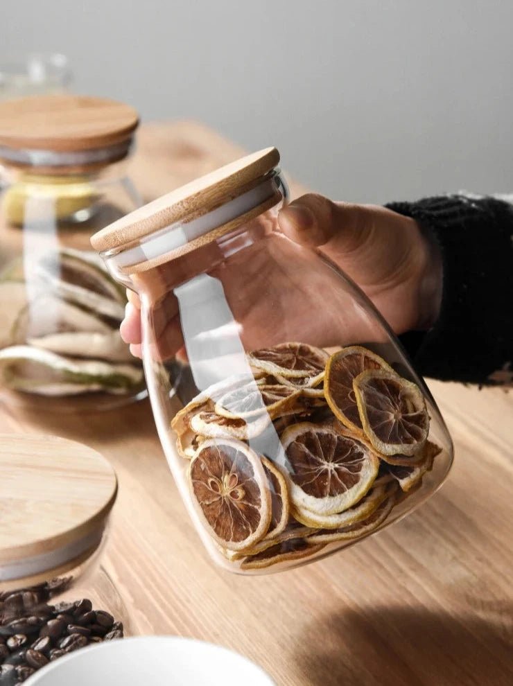 Glass Jar with wooden lid filled with dried slices of lemon