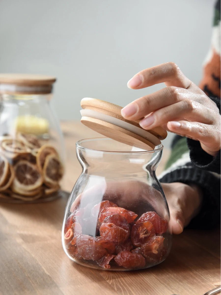 Glass Jar with wooden lid filled with Snacks and Nuts