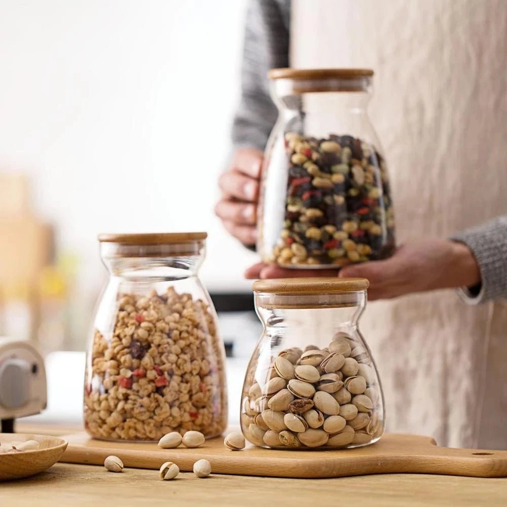 Glass Jars with wooden lid filled with nuts and seasonings