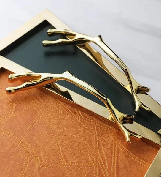 Golden Frame Leather Decorative Tray with Handle, enhancing a modern living room with elegance and functionality.