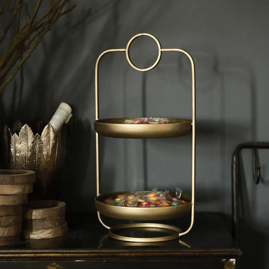 Golden retro iron holder with vintage style, perfect for displaying candles, snacks, or decorative items.