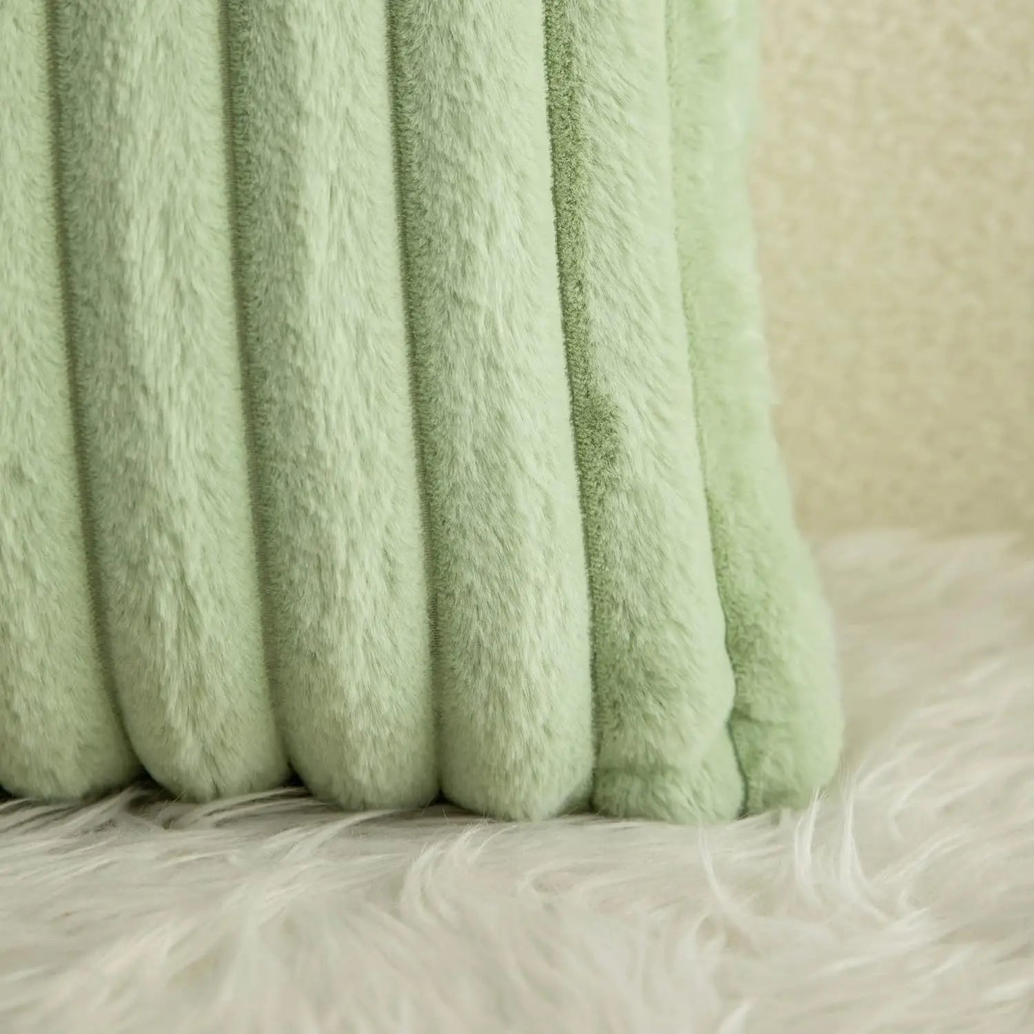 Green cushion covers with soft, plush fabric and minimalist striped design, perfect for adding comfort and style to sofas, living rooms, or cars.