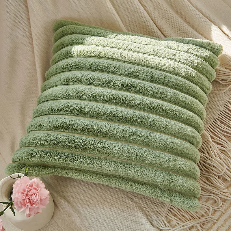 Green cushion covers with soft, plush fabric and minimalist striped design, perfect for adding comfort and style to sofas, living rooms, or cars.