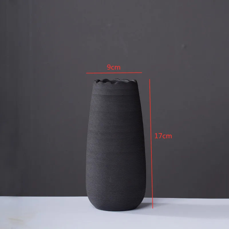 Handcrafted modern ceramic vase with a unique artisan design, featuring smooth curves and a minimalist aesthetic