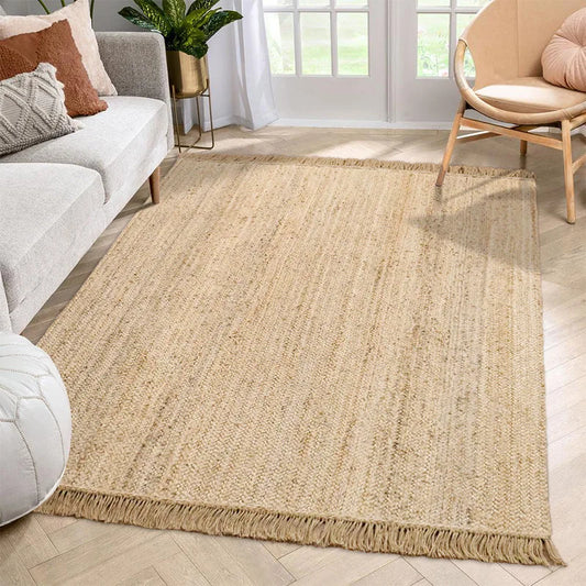 Hand-woven natural jute rug with tassels. Perfect for adding boho and Scandinavian charm to any space, durable and easy to care for. Ideal for contemporary décor.