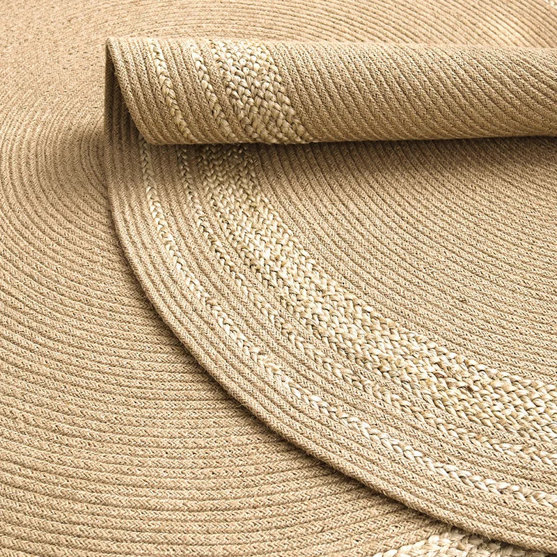 A handwoven natural jute carpet with a textured surface, made from eco-friendly materials for home décor.