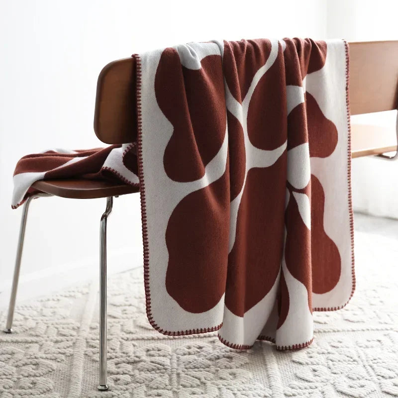 Minimalist cozy comfort patterned blanket with a soft, warm design ideal for enhancing home decor.