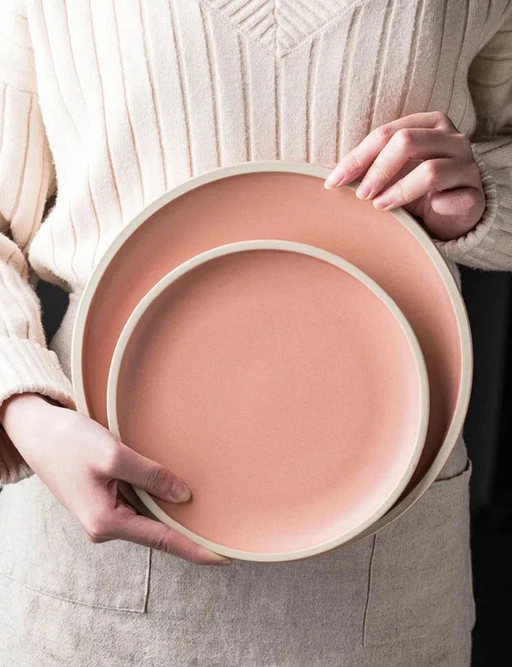 Japanese matte ceramic tableware in beige on a white table.