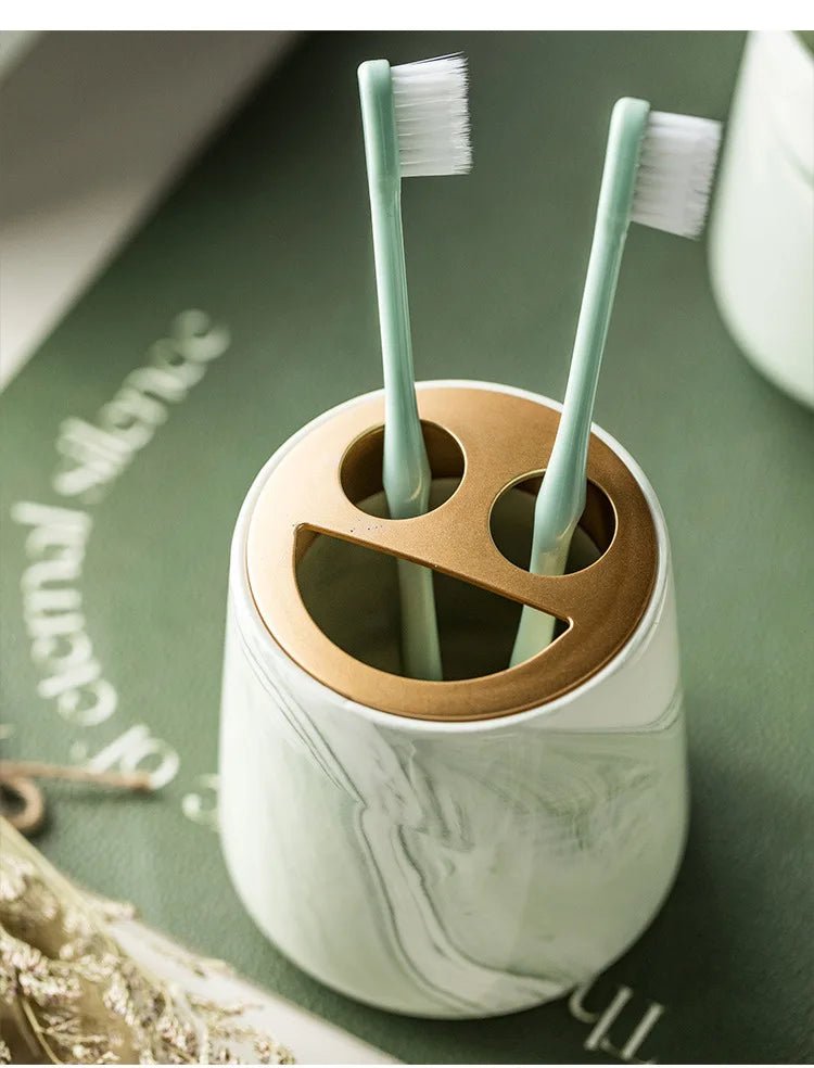 A marble toothbrush holder with a sleek, modern design, ideal for bathroom decor.