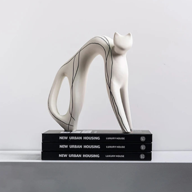 A small hand-painted cat figure with a simple and minimal design.