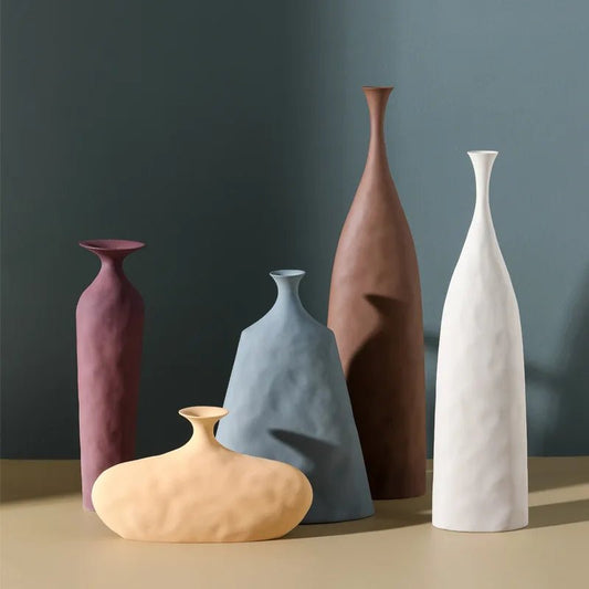 Scandinavian style ceramic vase for home or office. Modern design adds elegance and creativity to any decor. Perfect for flowers or as a standalone piece.