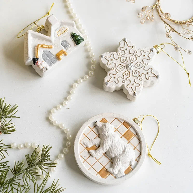 Nordic Christmas Charm Pendants in white and gold tones, featuring 10 designs such as a chimney house, polar bear, and soldier on horseback. Perfect for adding a rustic touch to festive holiday decor.