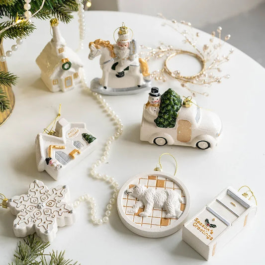 Nordic Christmas Charm Pendants in white and gold tones, featuring 10 designs such as a chimney house, polar bear, and soldier on horseback. Perfect for adding a rustic touch to festive holiday decor.